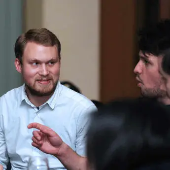 two-mature-male-students-in-a-conversation