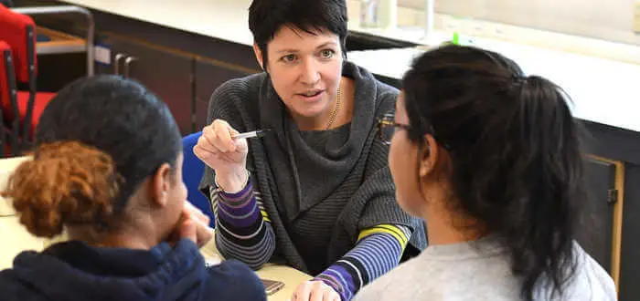 lecturer talking to students