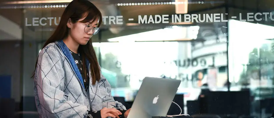 student looking at laptop