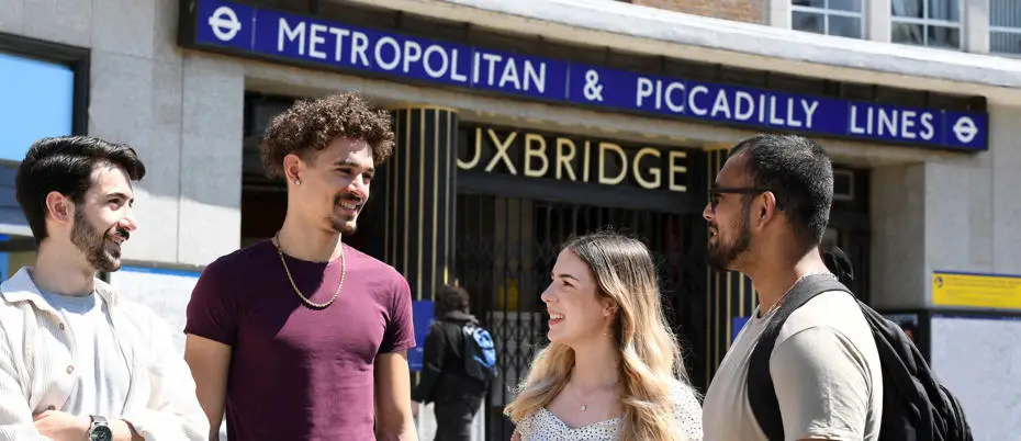 Students outside Uxbridge tube station chatting