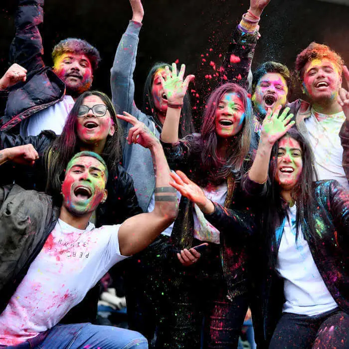 group of students celebrating holi